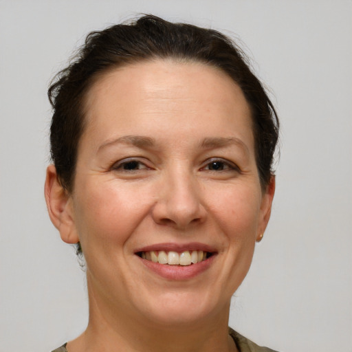 Joyful white adult female with short  brown hair and brown eyes