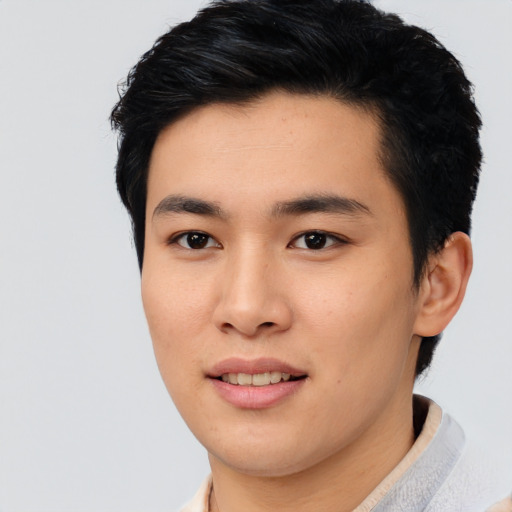 Joyful asian young-adult male with short  black hair and brown eyes