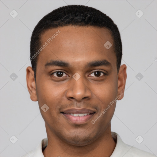 Joyful black young-adult male with short  black hair and brown eyes