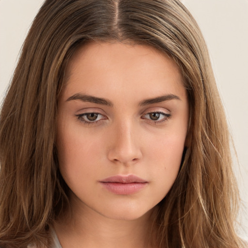 Neutral white young-adult female with long  brown hair and brown eyes