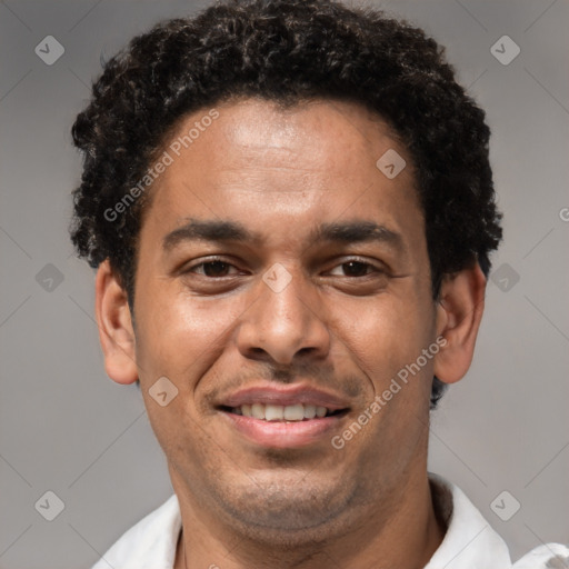 Joyful latino young-adult male with short  brown hair and brown eyes