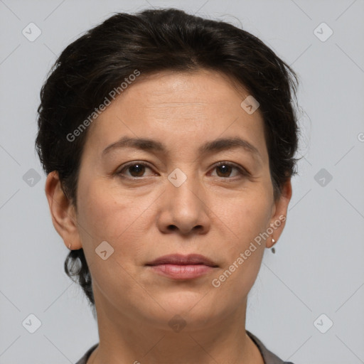 Joyful white adult female with short  brown hair and brown eyes