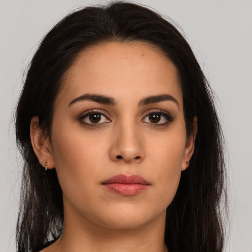Neutral latino young-adult female with long  brown hair and brown eyes
