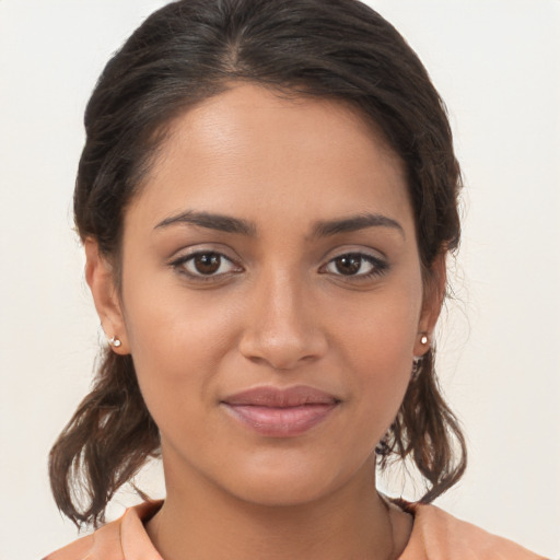 Joyful white young-adult female with medium  brown hair and brown eyes