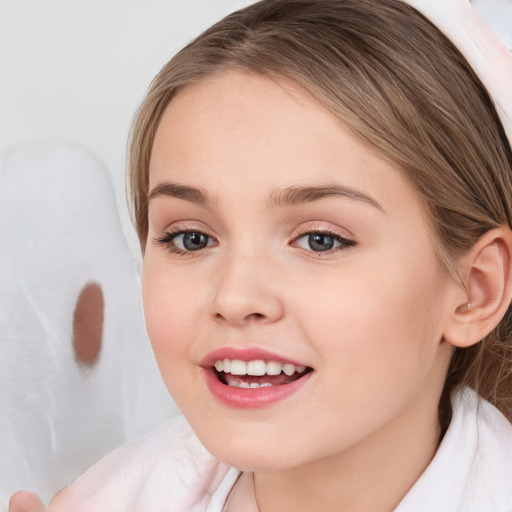 Joyful white child female with medium  brown hair and brown eyes