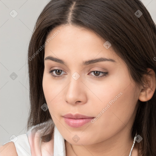 Neutral white young-adult female with long  brown hair and brown eyes