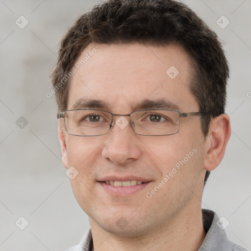 Joyful white adult male with short  brown hair and brown eyes