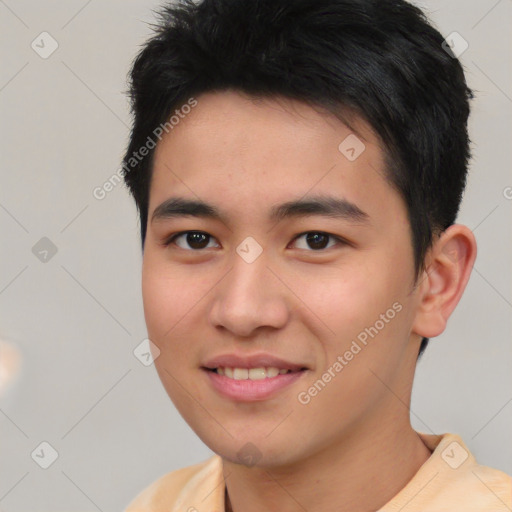 Joyful asian young-adult male with short  black hair and brown eyes