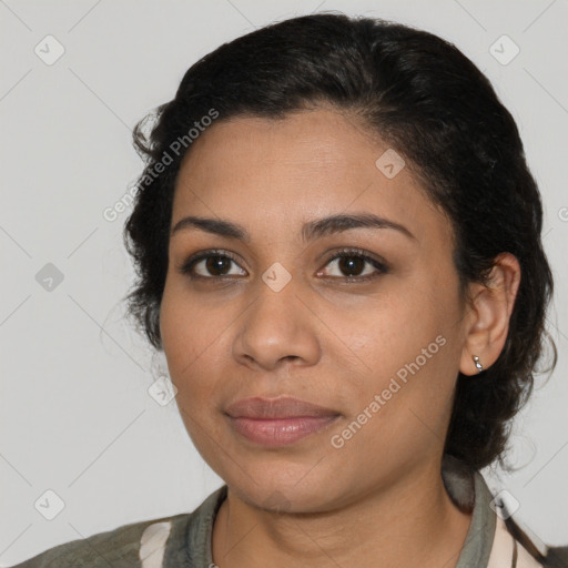 Joyful latino young-adult female with medium  brown hair and brown eyes