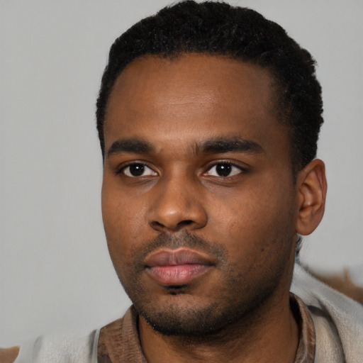 Neutral black young-adult male with short  black hair and brown eyes