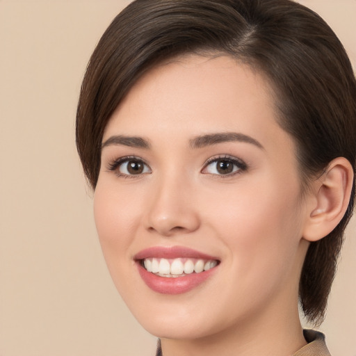 Joyful white young-adult female with medium  brown hair and brown eyes