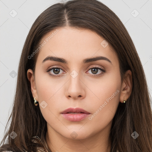 Neutral white young-adult female with long  brown hair and brown eyes