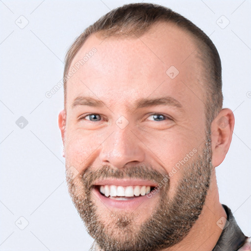 Joyful white adult male with short  brown hair and grey eyes