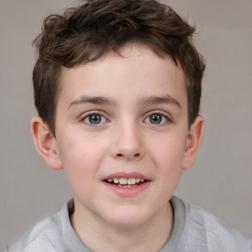 Joyful white child male with short  brown hair and brown eyes