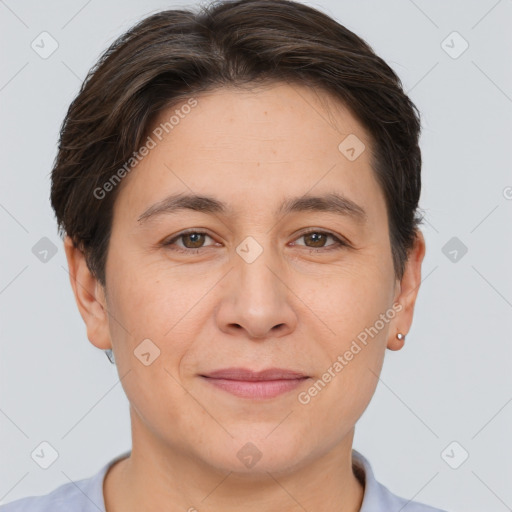 Joyful white adult female with short  brown hair and brown eyes