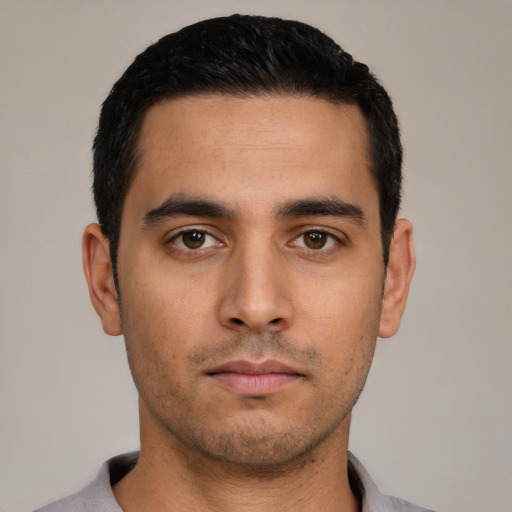 Neutral latino young-adult male with short  black hair and brown eyes