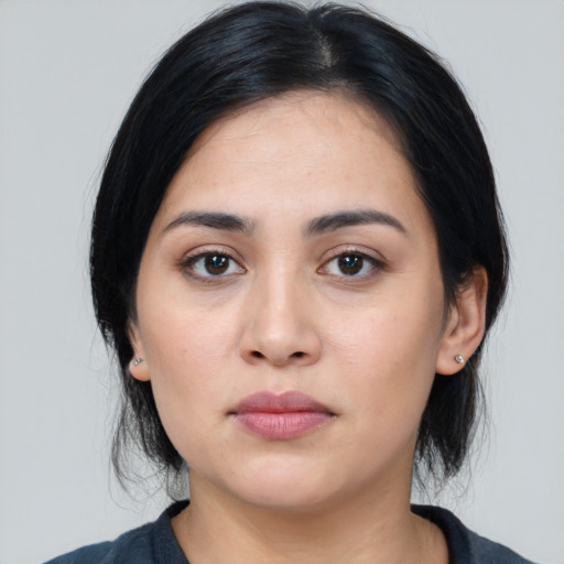 Neutral white young-adult female with medium  black hair and brown eyes