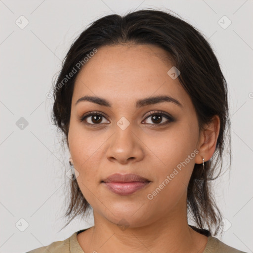 Joyful latino young-adult female with medium  brown hair and brown eyes