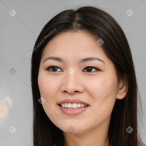 Joyful asian young-adult female with long  brown hair and brown eyes