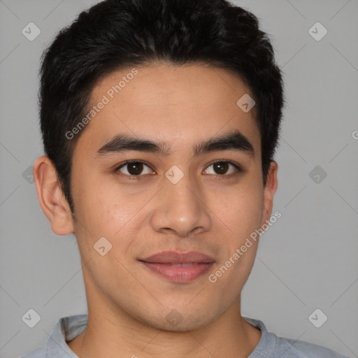 Joyful latino young-adult male with short  brown hair and brown eyes