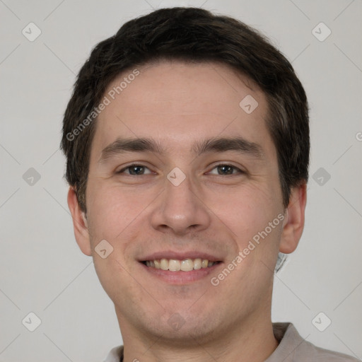 Joyful white young-adult male with short  brown hair and brown eyes