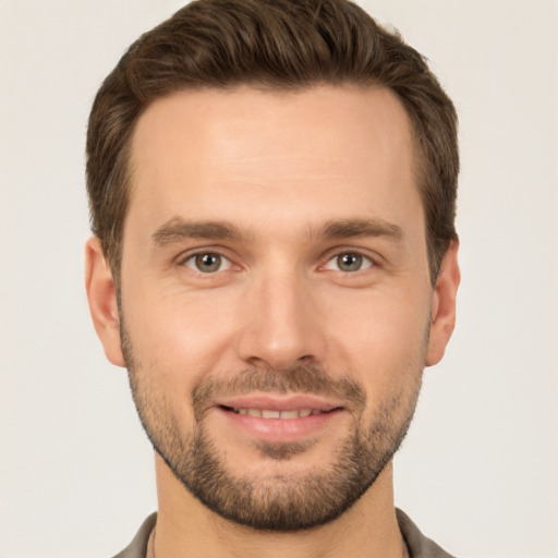 Joyful white young-adult male with short  brown hair and brown eyes