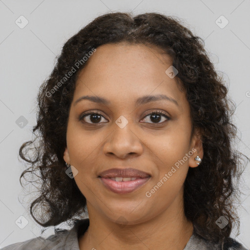 Joyful black young-adult female with medium  brown hair and brown eyes