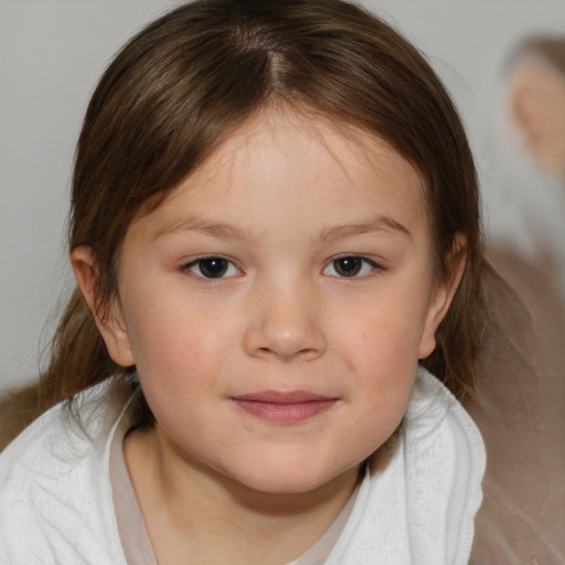 Joyful white child female with medium  brown hair and brown eyes