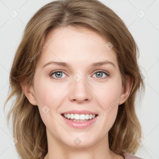 Joyful white young-adult female with medium  brown hair and blue eyes