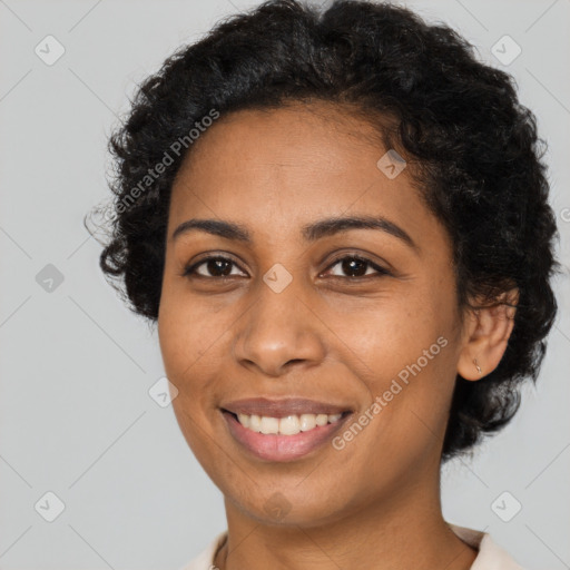 Joyful latino young-adult female with short  brown hair and brown eyes