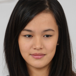 Joyful asian young-adult female with long  brown hair and brown eyes