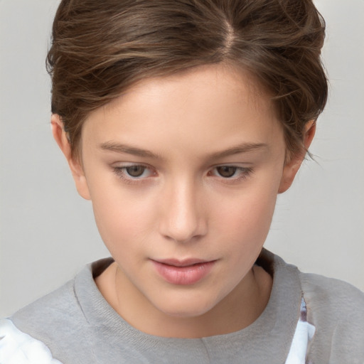 Joyful white child female with short  brown hair and brown eyes