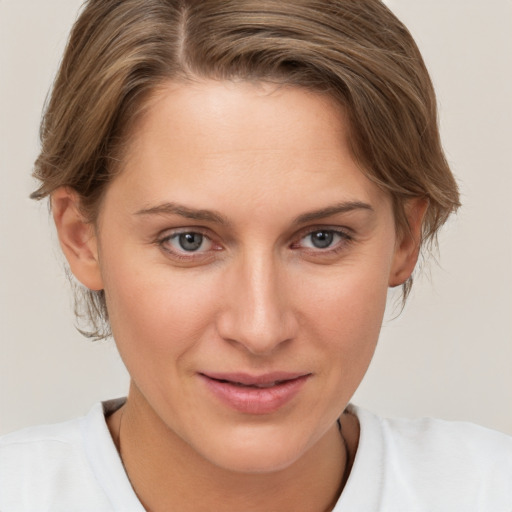 Joyful white young-adult female with medium  brown hair and brown eyes