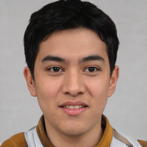 Joyful asian young-adult male with short  black hair and brown eyes