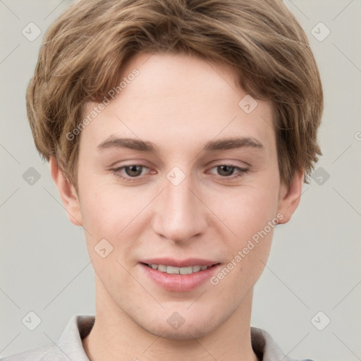 Joyful white young-adult female with short  brown hair and grey eyes