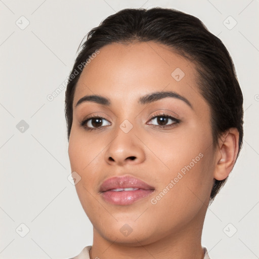 Joyful latino young-adult female with short  black hair and brown eyes