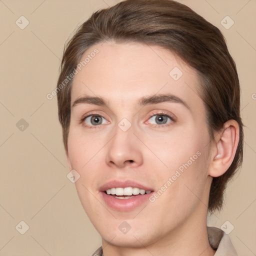 Joyful white young-adult female with medium  brown hair and brown eyes