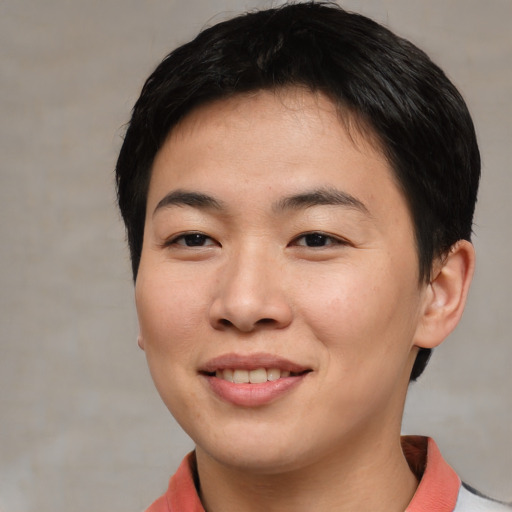 Joyful asian young-adult female with short  brown hair and brown eyes