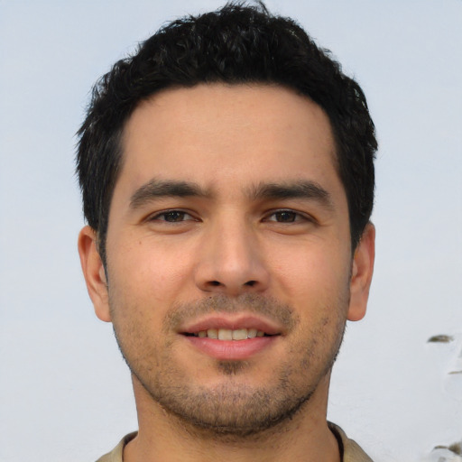 Joyful asian young-adult male with short  brown hair and brown eyes