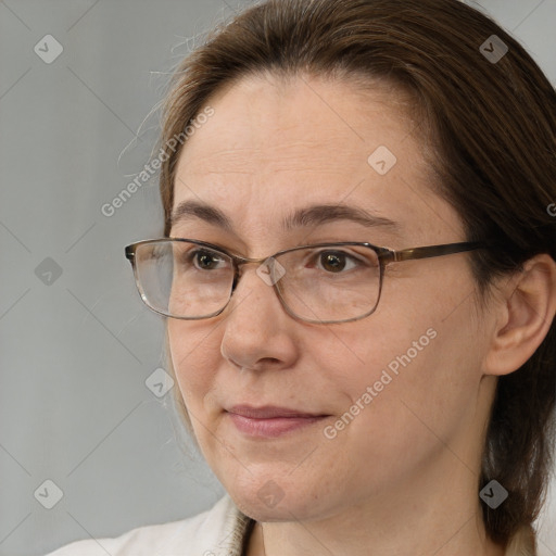 Joyful white adult female with medium  brown hair and brown eyes