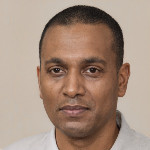 Neutral black adult male with short  black hair and brown eyes