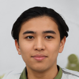 Joyful asian young-adult male with short  black hair and brown eyes