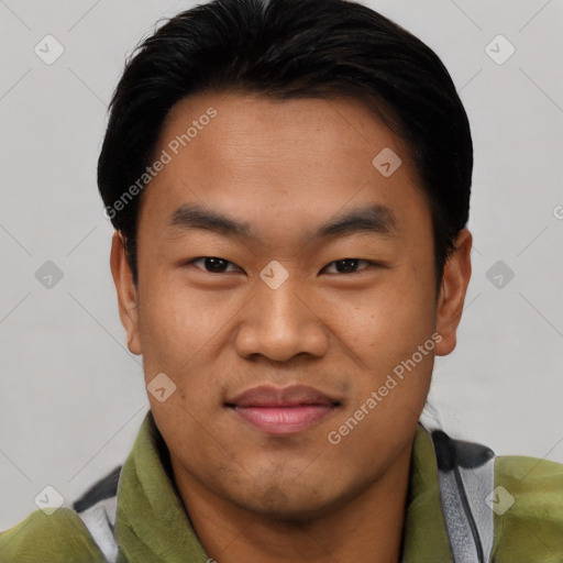 Joyful asian young-adult male with short  black hair and brown eyes