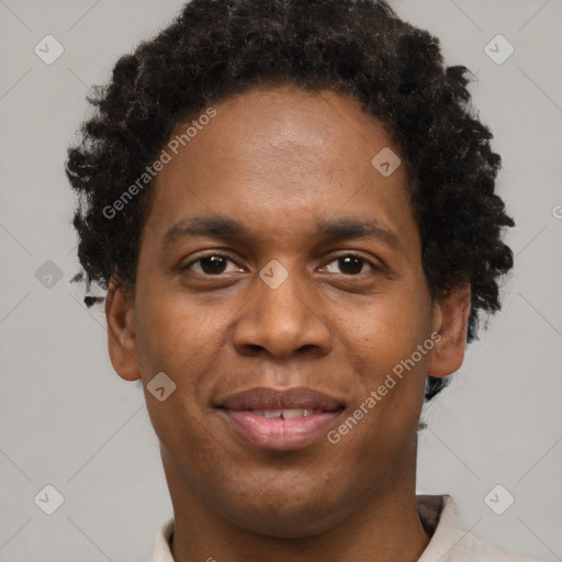 Joyful black young-adult male with short  brown hair and brown eyes