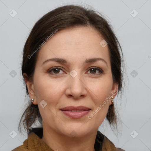 Joyful white adult female with medium  brown hair and brown eyes