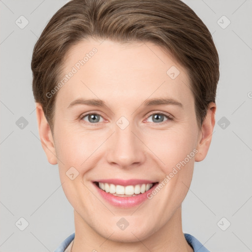 Joyful white young-adult female with short  brown hair and grey eyes