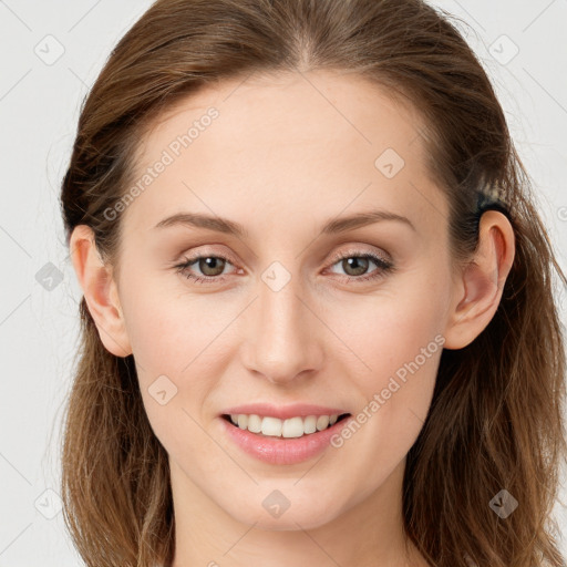 Joyful white young-adult female with long  brown hair and blue eyes