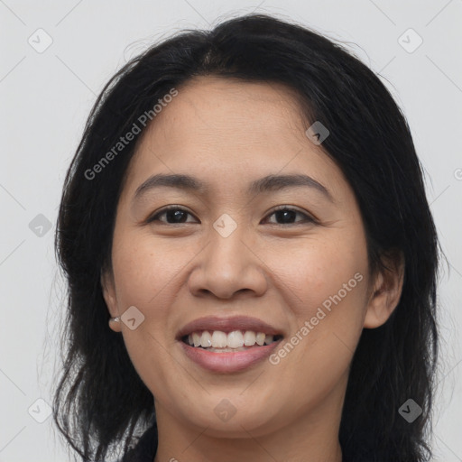 Joyful asian young-adult female with long  brown hair and brown eyes