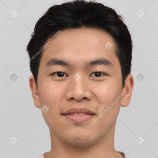 Joyful asian young-adult male with short  black hair and brown eyes