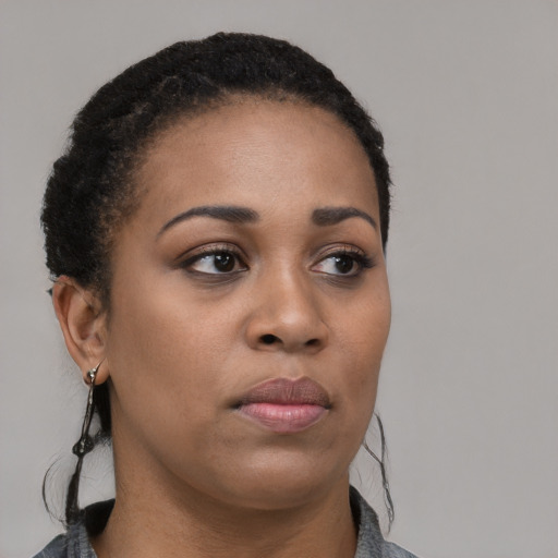Neutral black young-adult female with medium  black hair and brown eyes